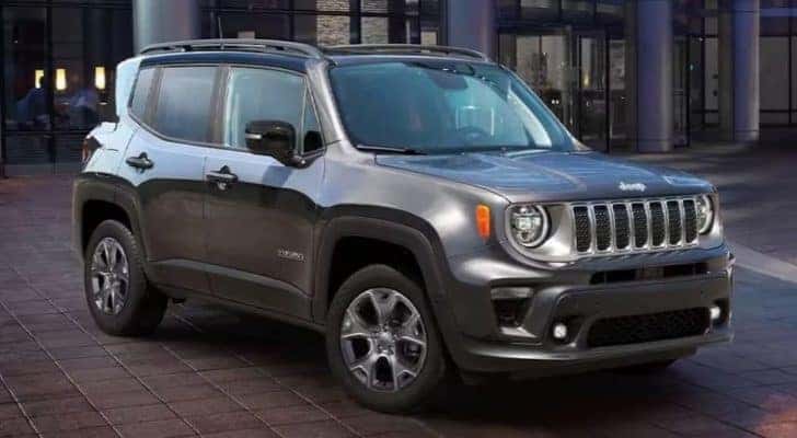 A silver 2023 Jeep Renegade is shown parked near a Jeep dealer near Statesville.