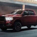 A red 2024 Ram 2500 for sale parked at a dealership.