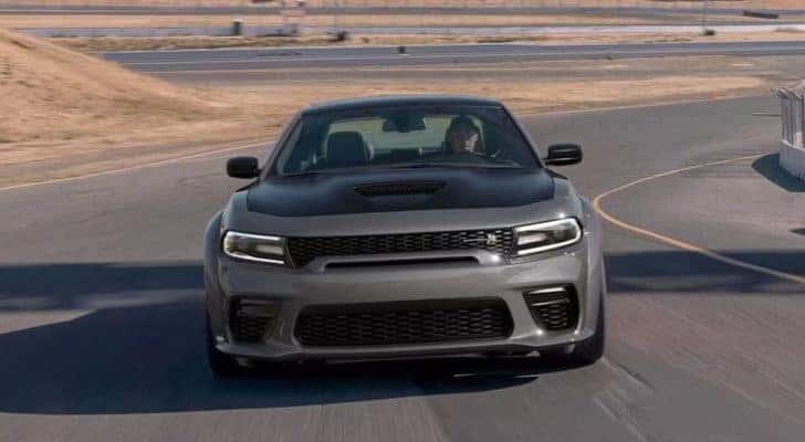 A grey 2023 Dodge Charger Scat Pack Widebody is shown from the front.