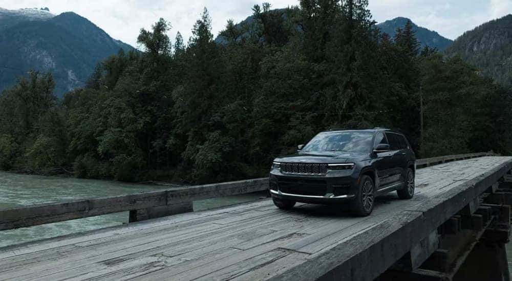 A grey 2024 Jeep Grand Cherokee L for sale is shown from the front at an angle.