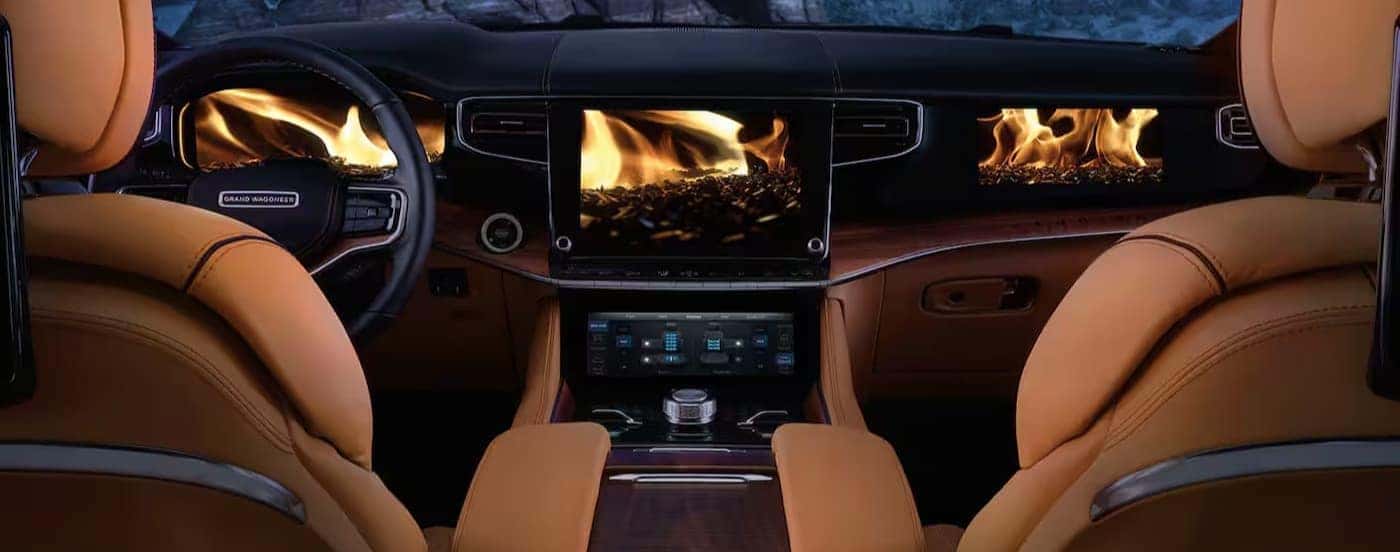 The black and tan interior and dash are shown in a 2025 Jeep Grand Wagoneer.