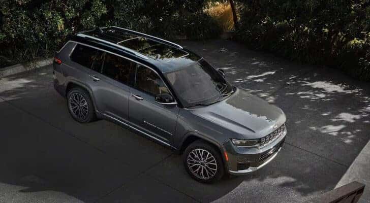 A grey 2024 Jeep Grand Cherokee L is shown from the front at a high angle.