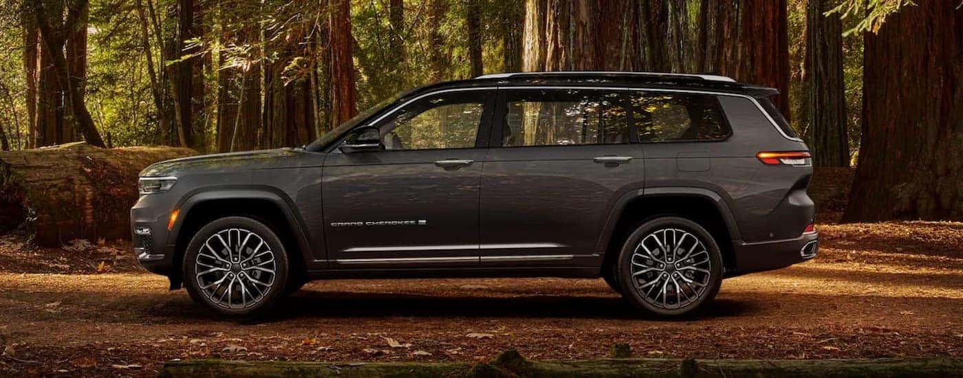 A grey 2024 Jeep Grand Cherokee L for sale is shown from the side.