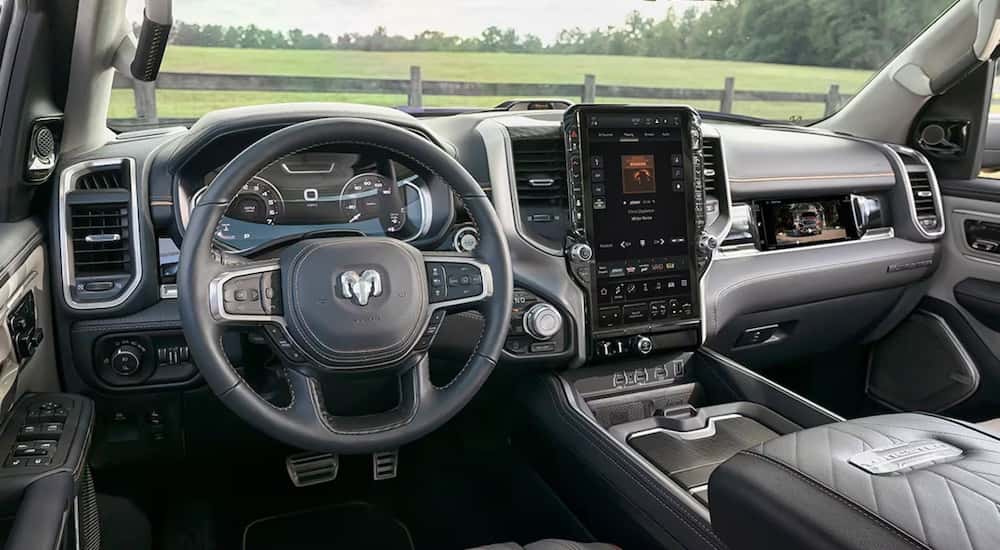 The black interior of a 2025 Ram 1500 Tungsten is shown from the drivers seat after leaving a Ram dealer near Statesville.