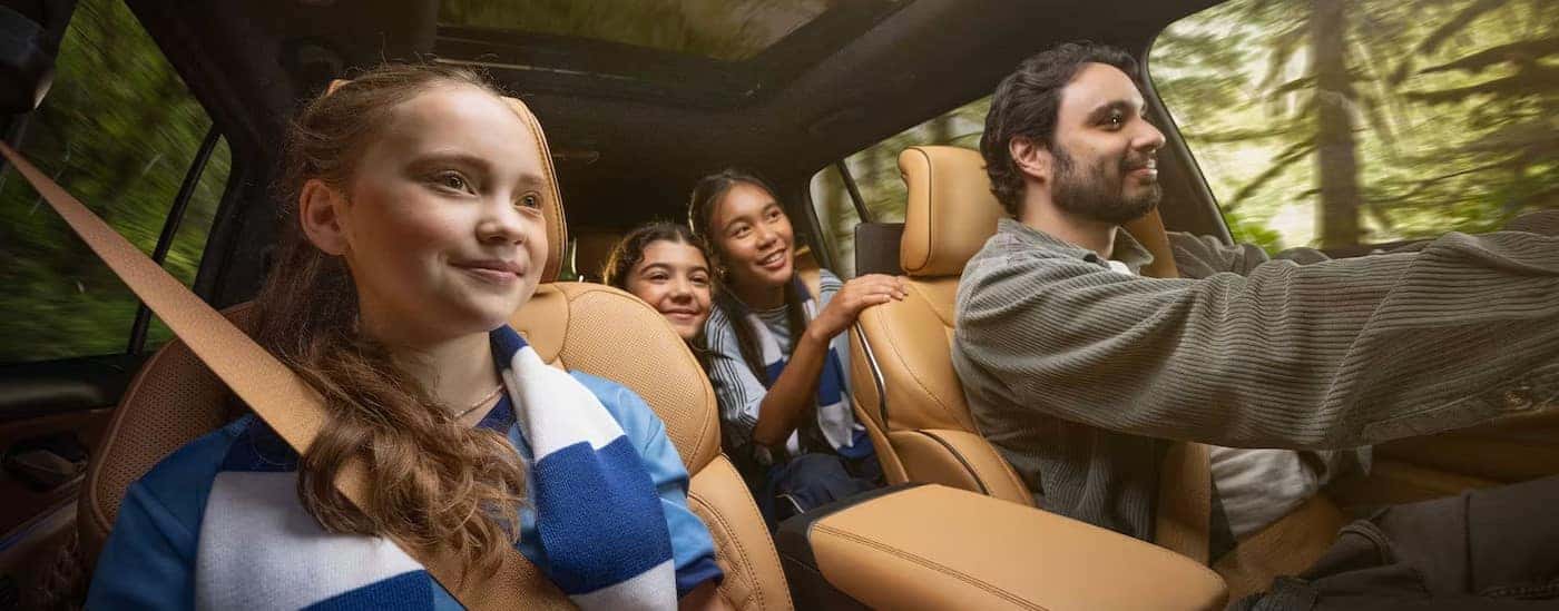A family in a 2025 Jeep Grand Cherokee for sale near Mooresville.