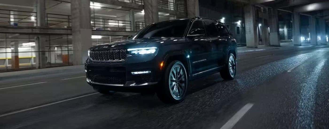 A black 2025 Jeep Grand Cherokee driving in a tunnel.