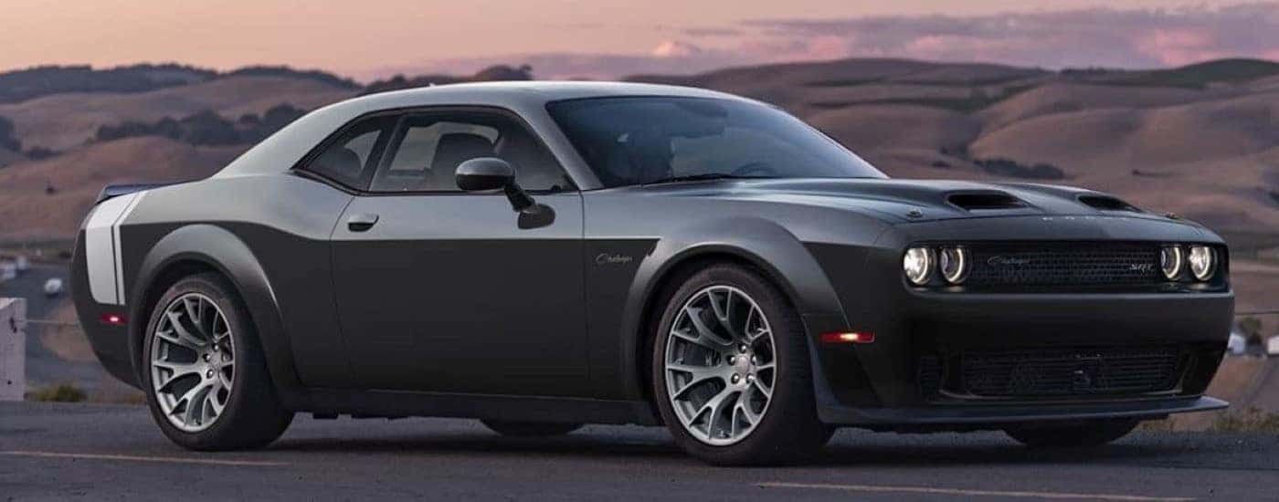 A black 2023 Dodge Challenger SRT Ghost parked after visiting a Dodge dealer near Concord.