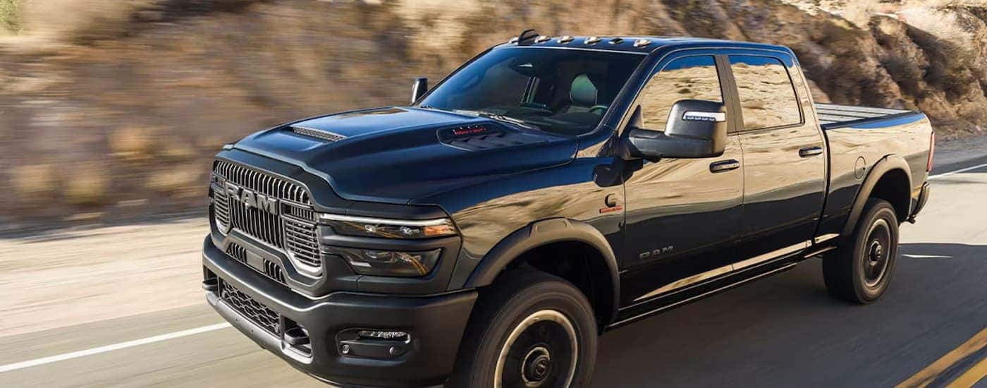 Black 2025 Ram 2500 driving down the highway