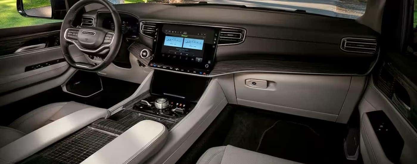 The black and gray interior in a 2024 Jeep Wagoneer for sale near Huntersville.