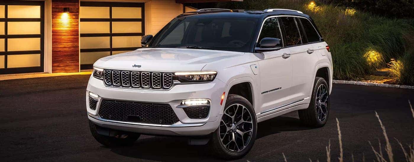 A white 2025 Jeep Grand Cherokee L parked in a driveway