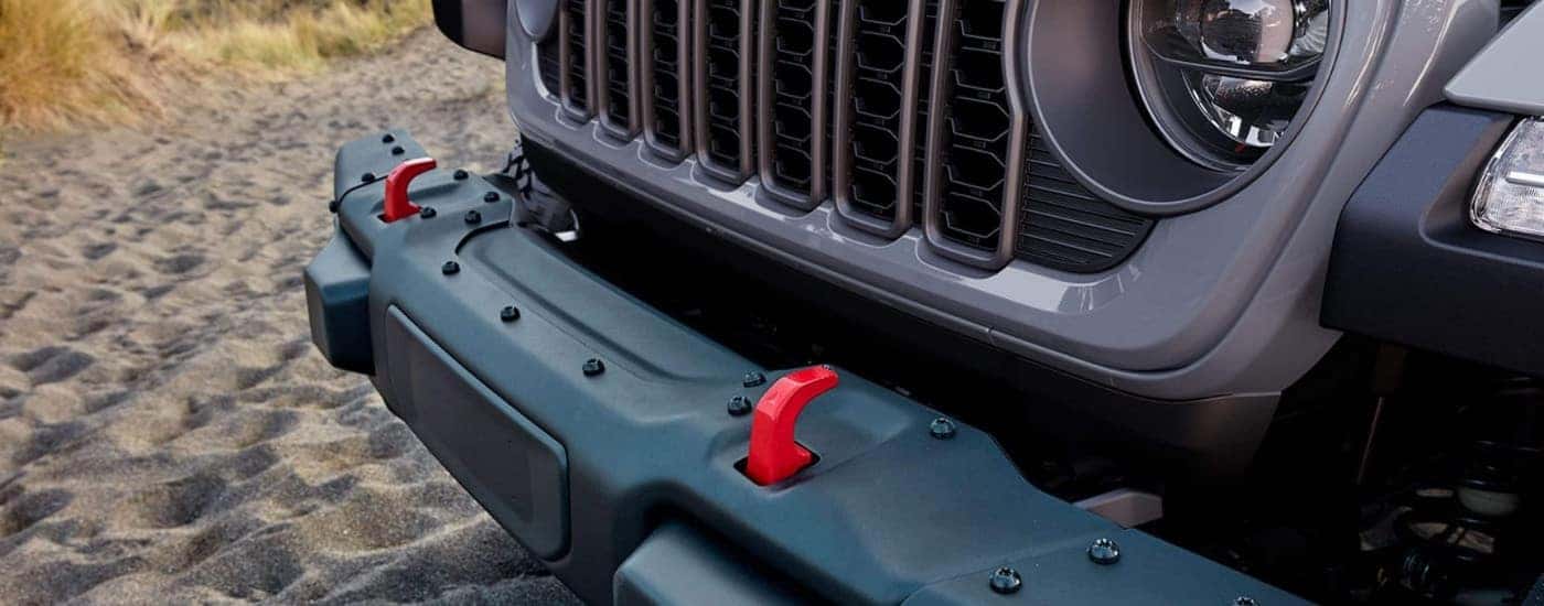 Red tow hooks on a grey 2025 Jeep Gladiator.