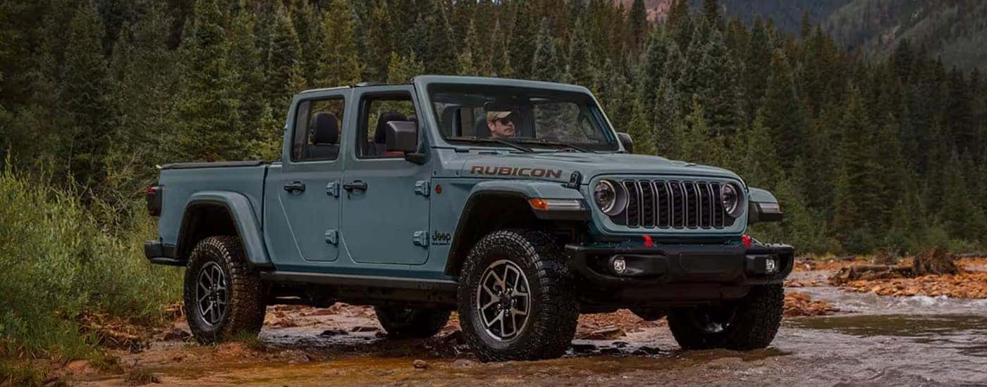 A grey 2025 Jeep Gladiator from the front.