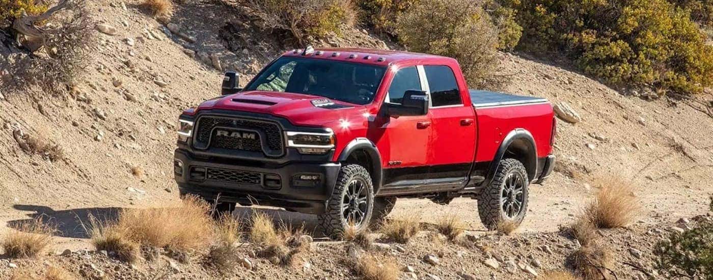 A red 2025 Ram 2500 from the front after leaving a dealer that has a used Ram for sale in Cornelius.