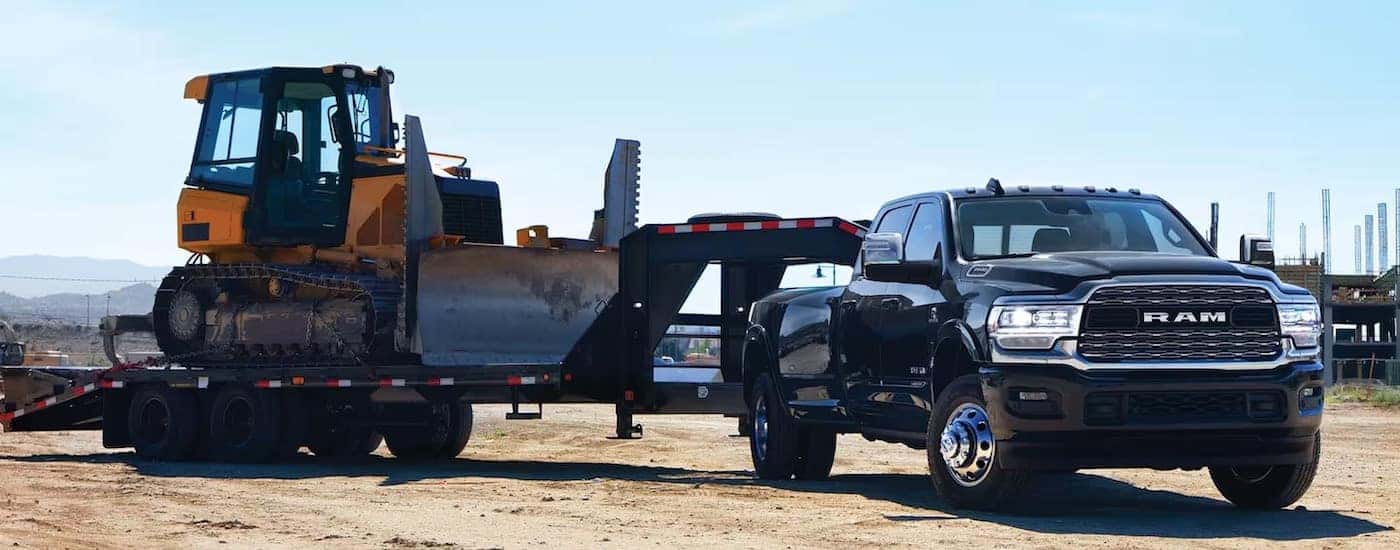A black 2024 Ram 3500 from the front at an angle.