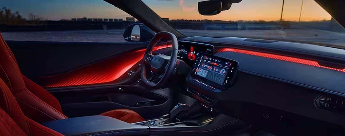 The black snd red interior and dash in a 2025 Dodge Charger for sale near Huntersville.
