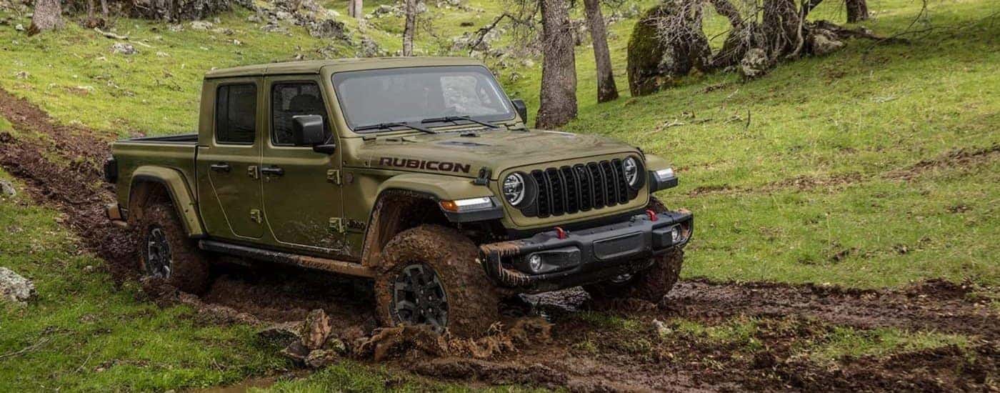 A green 2024 Jeep Gladiator from the side after leaving a dealer that has a used Jeep for sale near Mooresville.