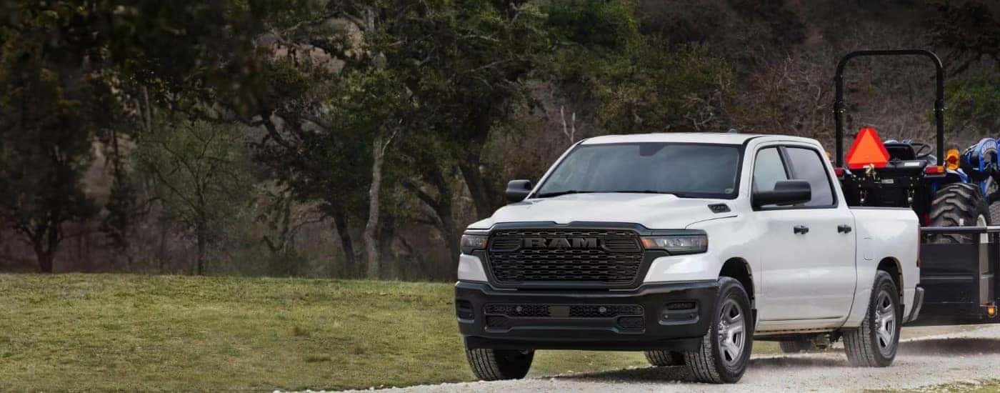 A white 2025 Ram 1500 from the front.