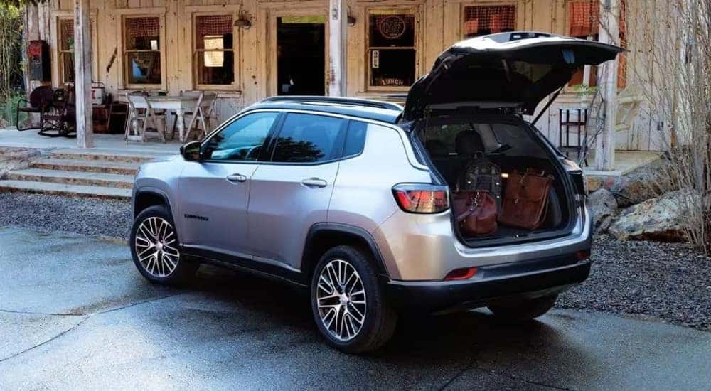 Luggage in the trunk of a silver 2023 Jeep Compass