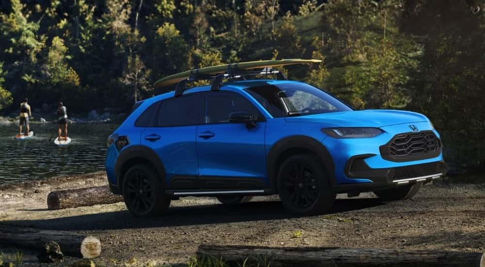 Blue 2026 Honda HR-V Sport parked near a lake