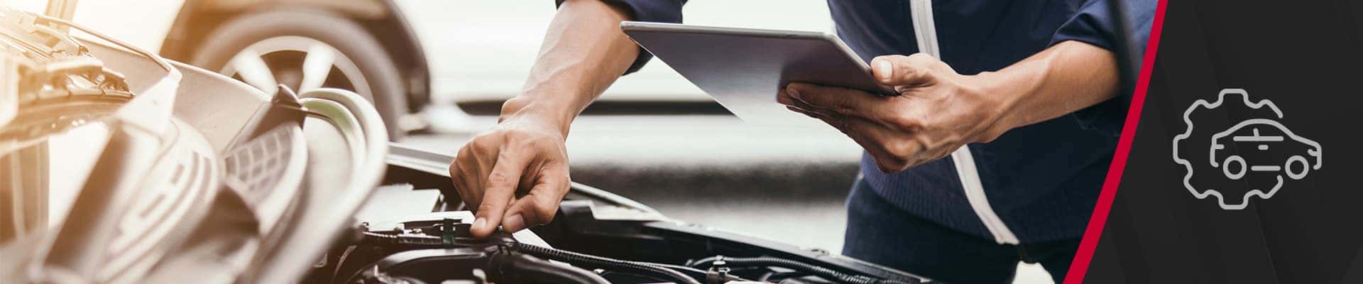 Man Inspecting Vehicle