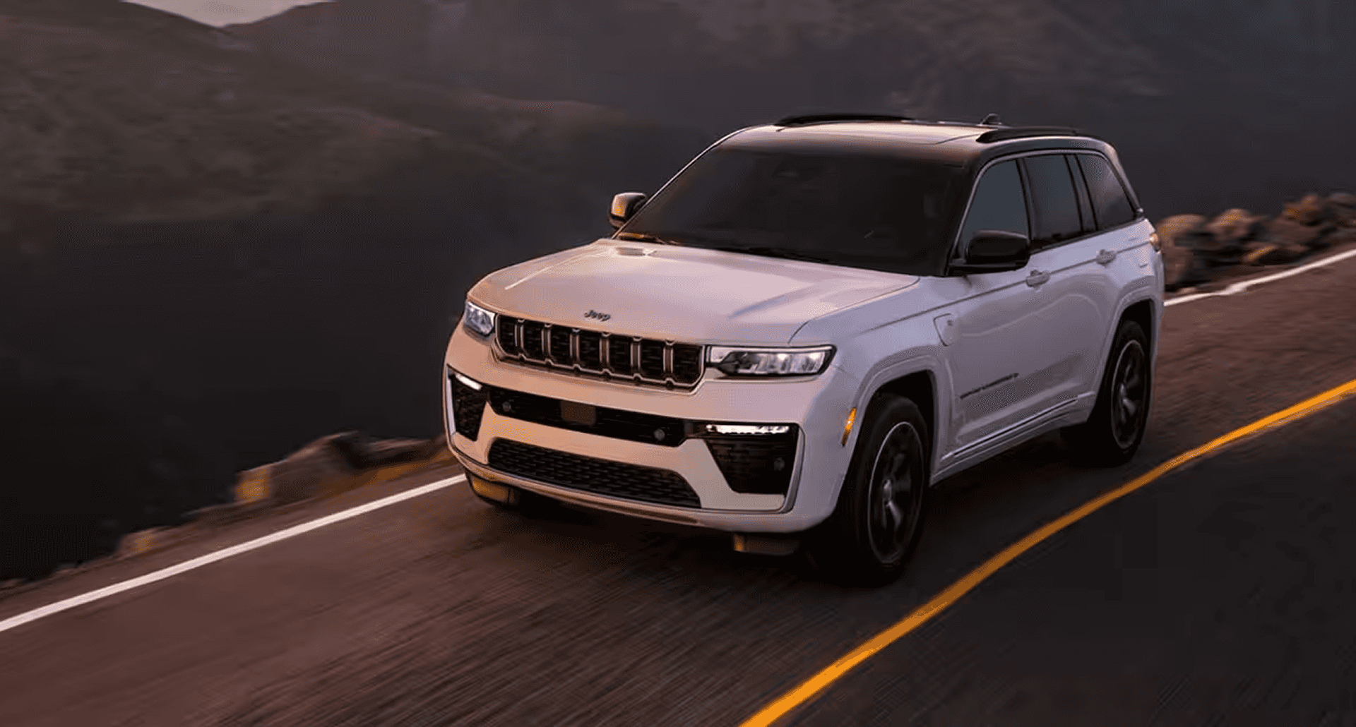 2026 Jeep Grand Cherokee driving on mountain road