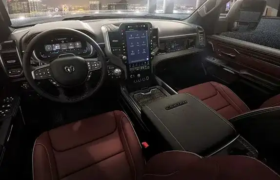 Dashboard and front seats of the 2027 Ram 1500 in red-brown leather