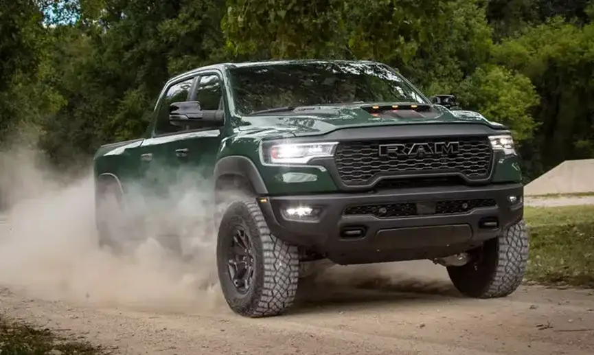 Green 2027 Ram 1500 kicking up dust on a dirt trail