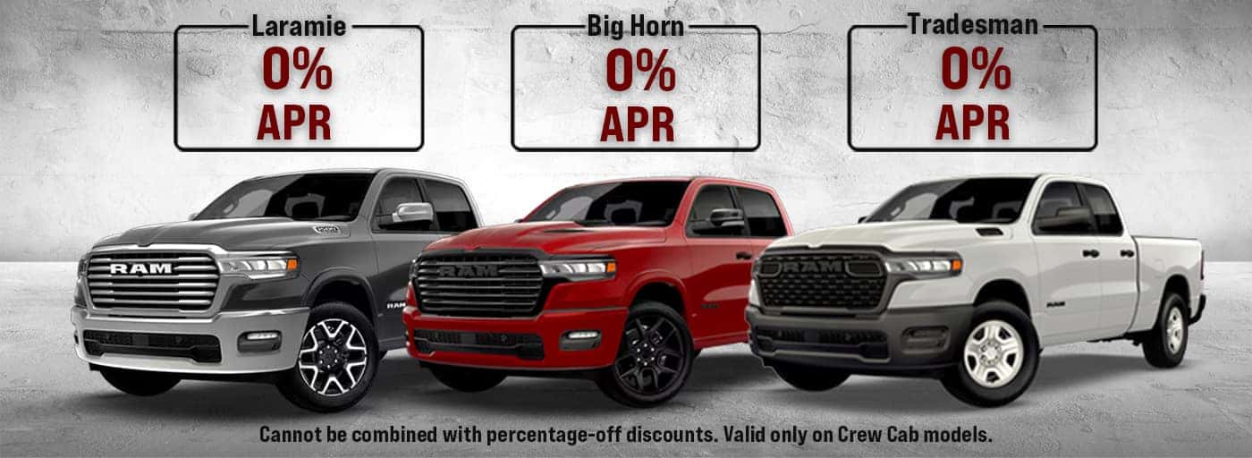 RAM truck promotional ad showing Laramie, Big Horn, and Tradesman models, all offering 0% APR. Fine print notes that the offer cannot be combined with percentage-off discounts and is valid only on Crew Cab models.