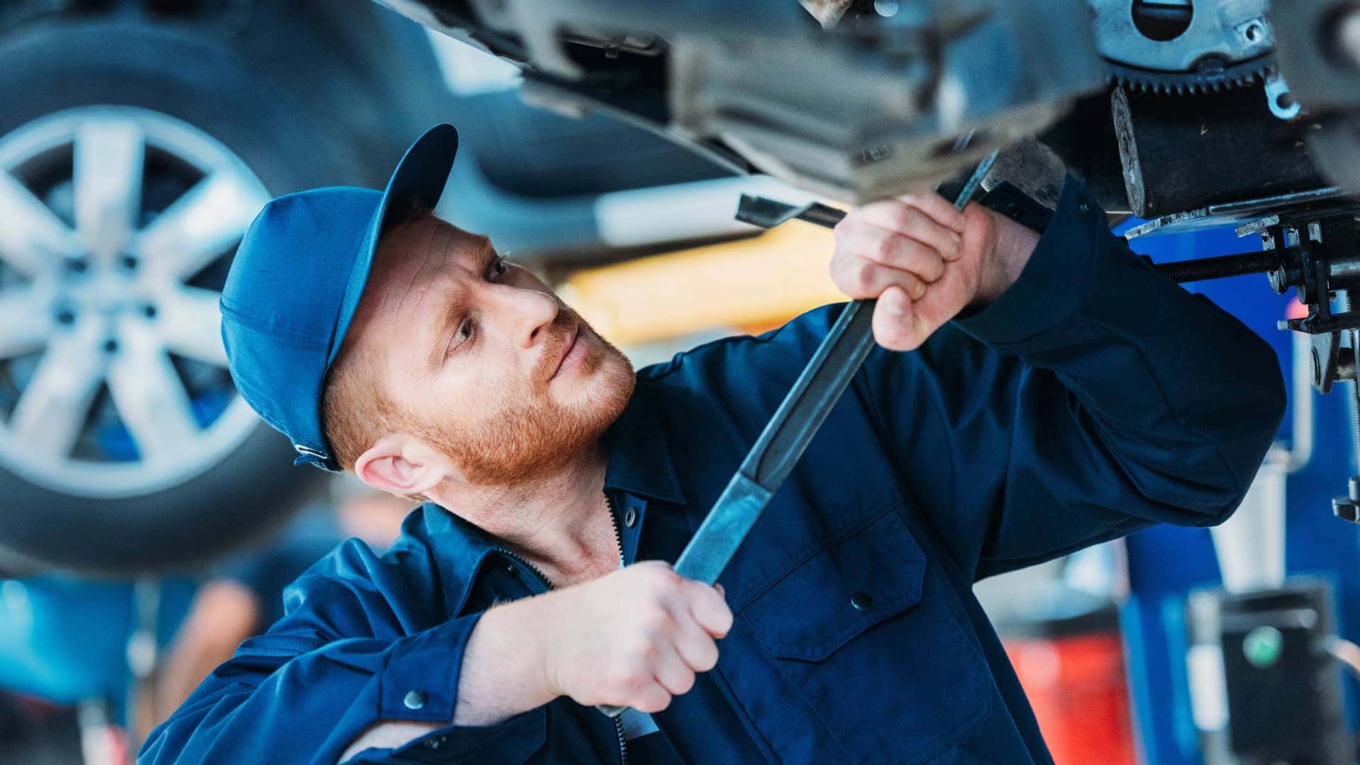 service technician working on vehicle