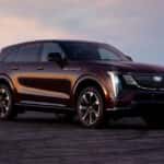 2026 CADILLAC ESCALADE IQ SUV Black Cherry Tintcoat parked in an open area