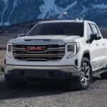 2024 GMC Sierra 1500 parked in front of mountains