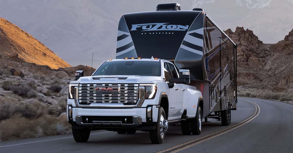 GMC Sierra HD towing a large Keystone Fuzion fifth-wheel toy hauler/RV