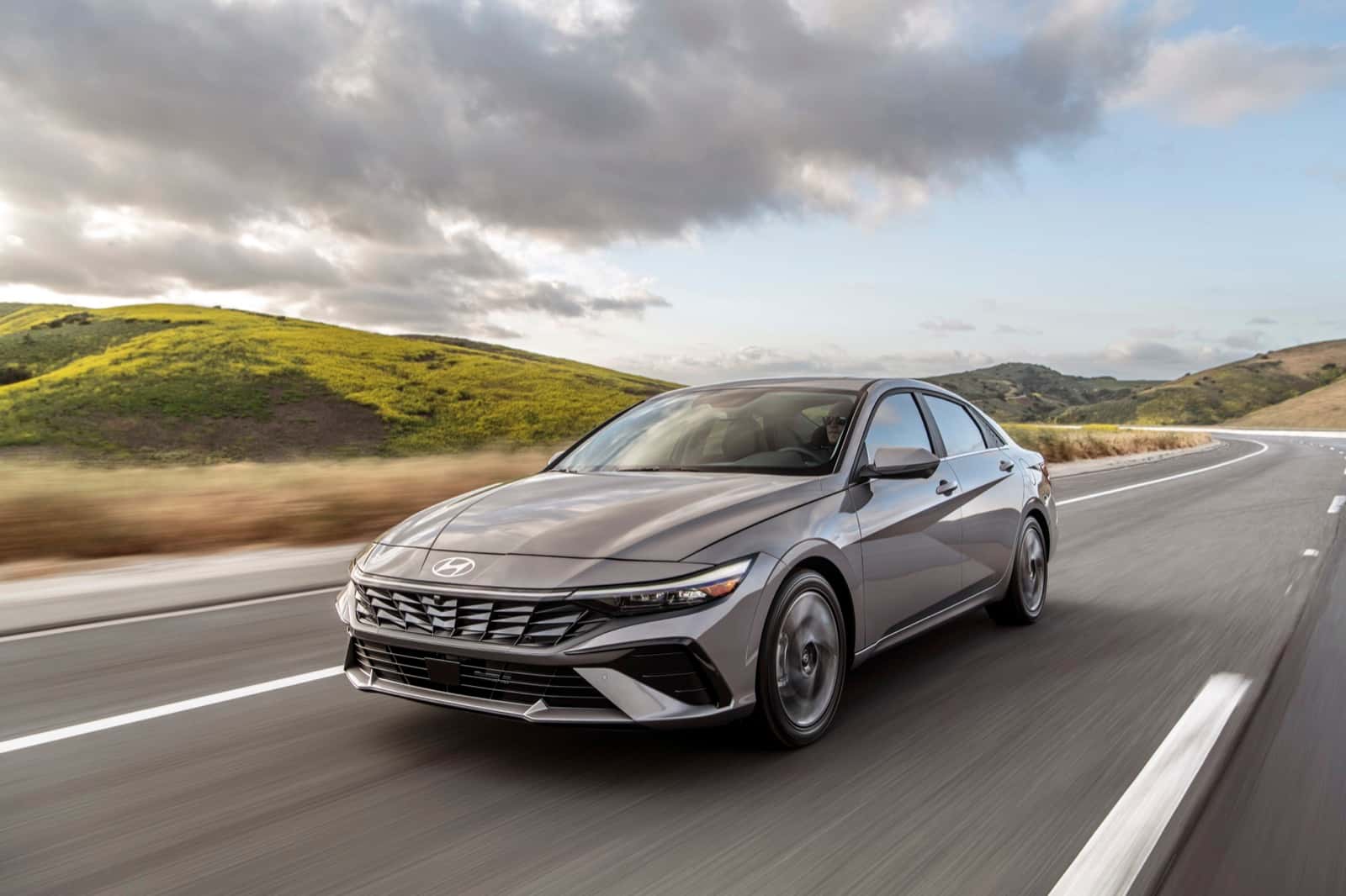 Gray Hyundai Elantra sedan driving on a highway