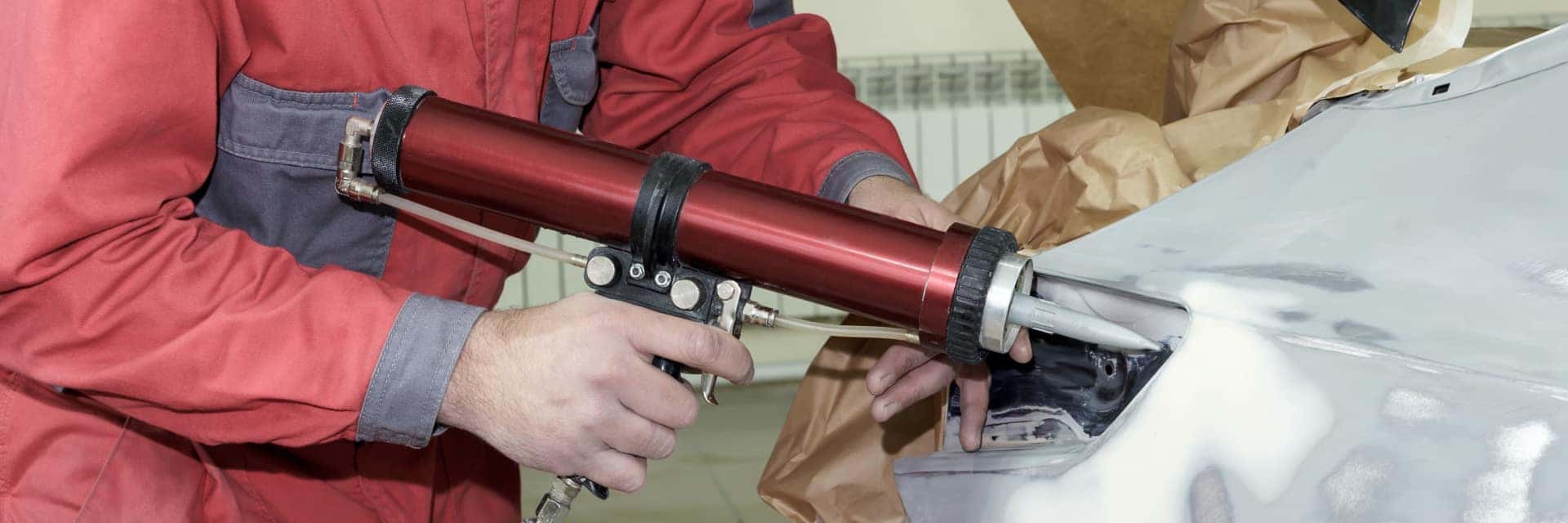 collision technician working on vehicle