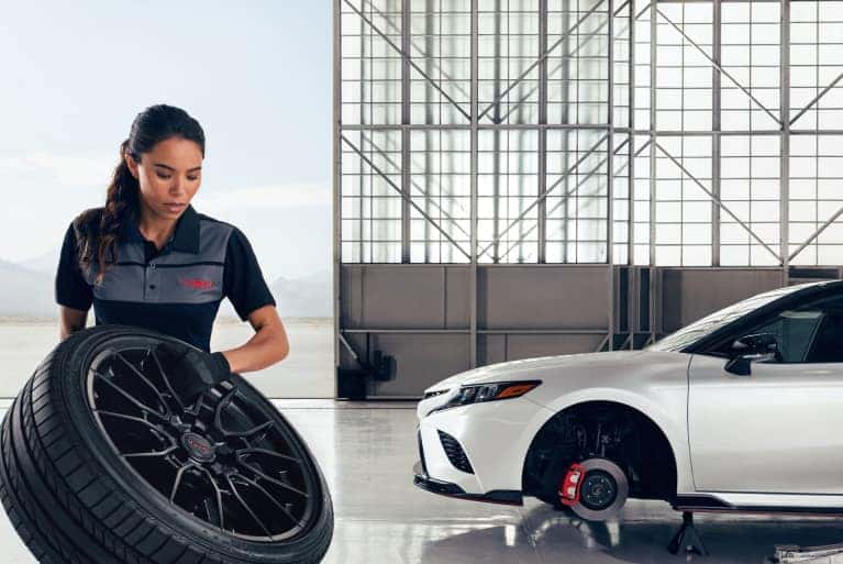 service tech with tire