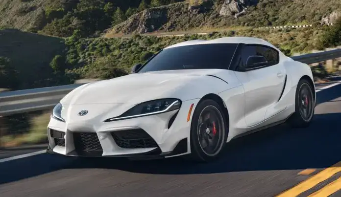 Toyota GR Supra driving on a highway