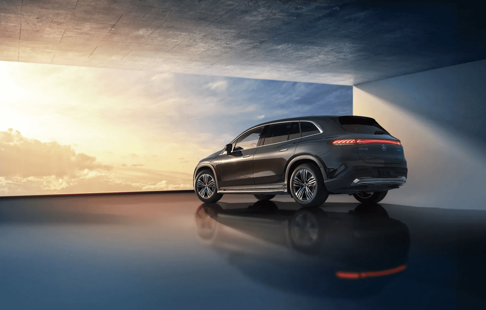 Rear view of the EQS SUV with an image of a sky in front of it