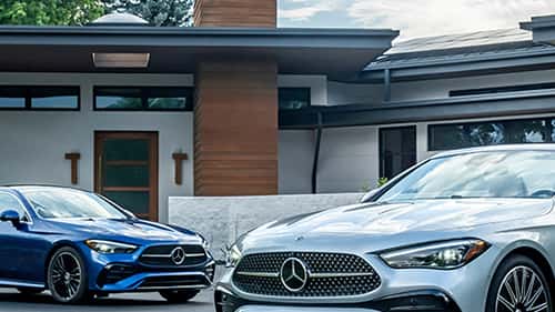 Mercedes-Benz Models in front of a house
