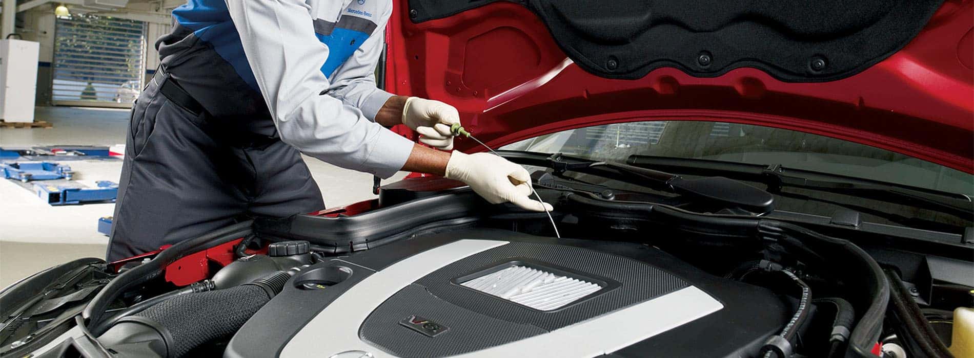 Mechanic Servicing Engine