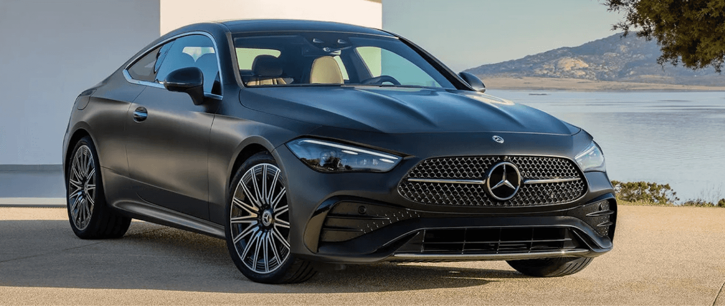 A 2024 Mercedes-Benz CLE parked outside in front of a building and water
