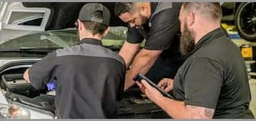 mechanics working on sprinter van
