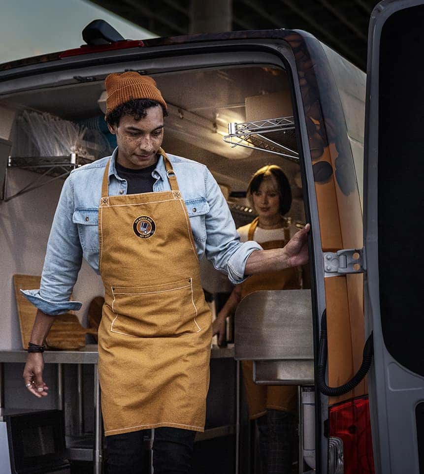 Worker loading HVAC van