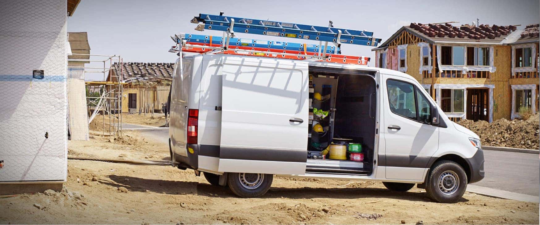 Electrician and telecom van on jobsite