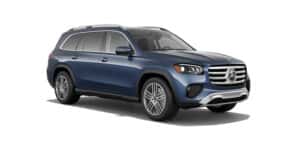 Side profile view of a dark blue Mercedes-Benz GLS SUV parked against a white background, highlighting its luxury design and alloy wheels.