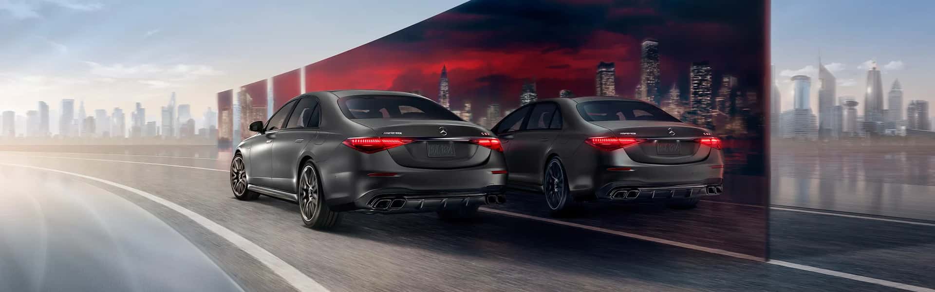 A black Mercedes-Benz C-Class Sedan driving on a road.