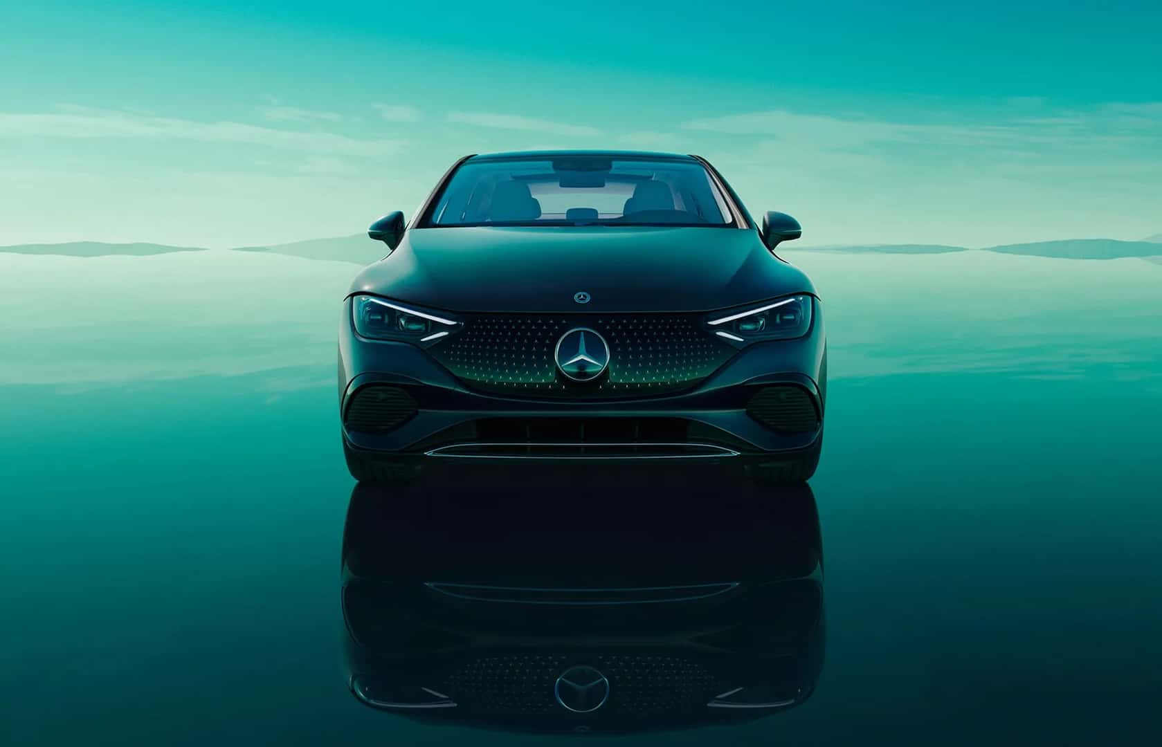 2026 Mercedes-Benz EQE luxury electric sedan driving smoothly on an open road