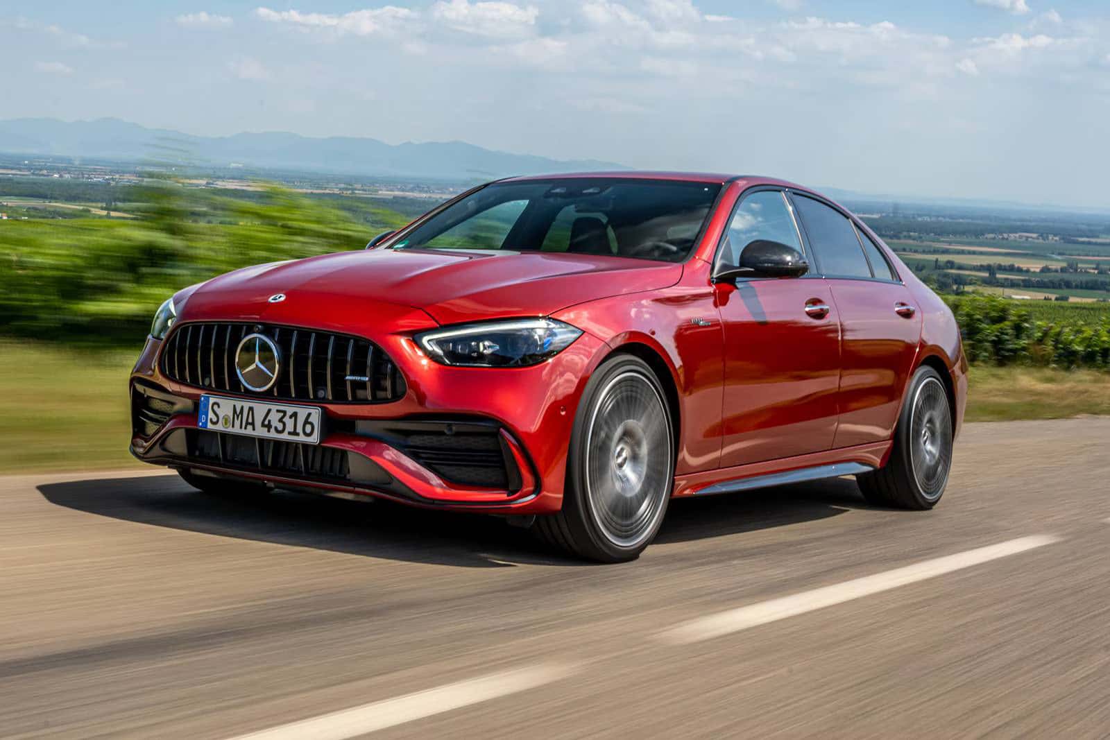 2026 Mercedes-Benz C 300 Sedan driving down a Wisconsin road.