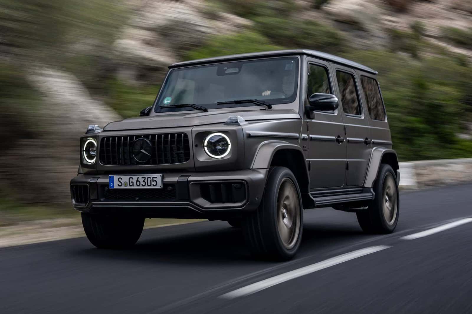 2026 Mercedes-Benz G-Class SUV driving on the road.