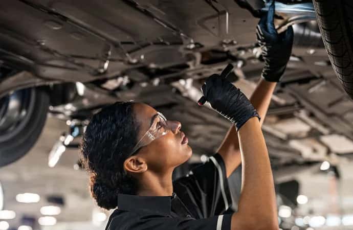 Mercedes-Benz certified technicians performing synthetic motor oil replacement