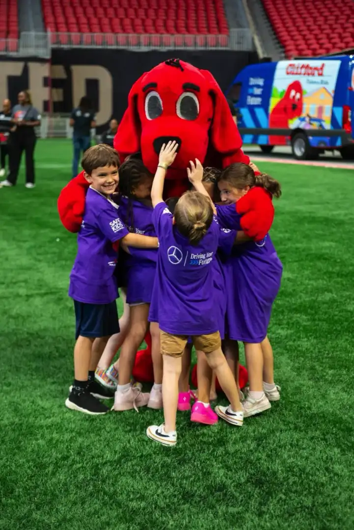 Clifford and Kids at Mercedes Benz event on a field